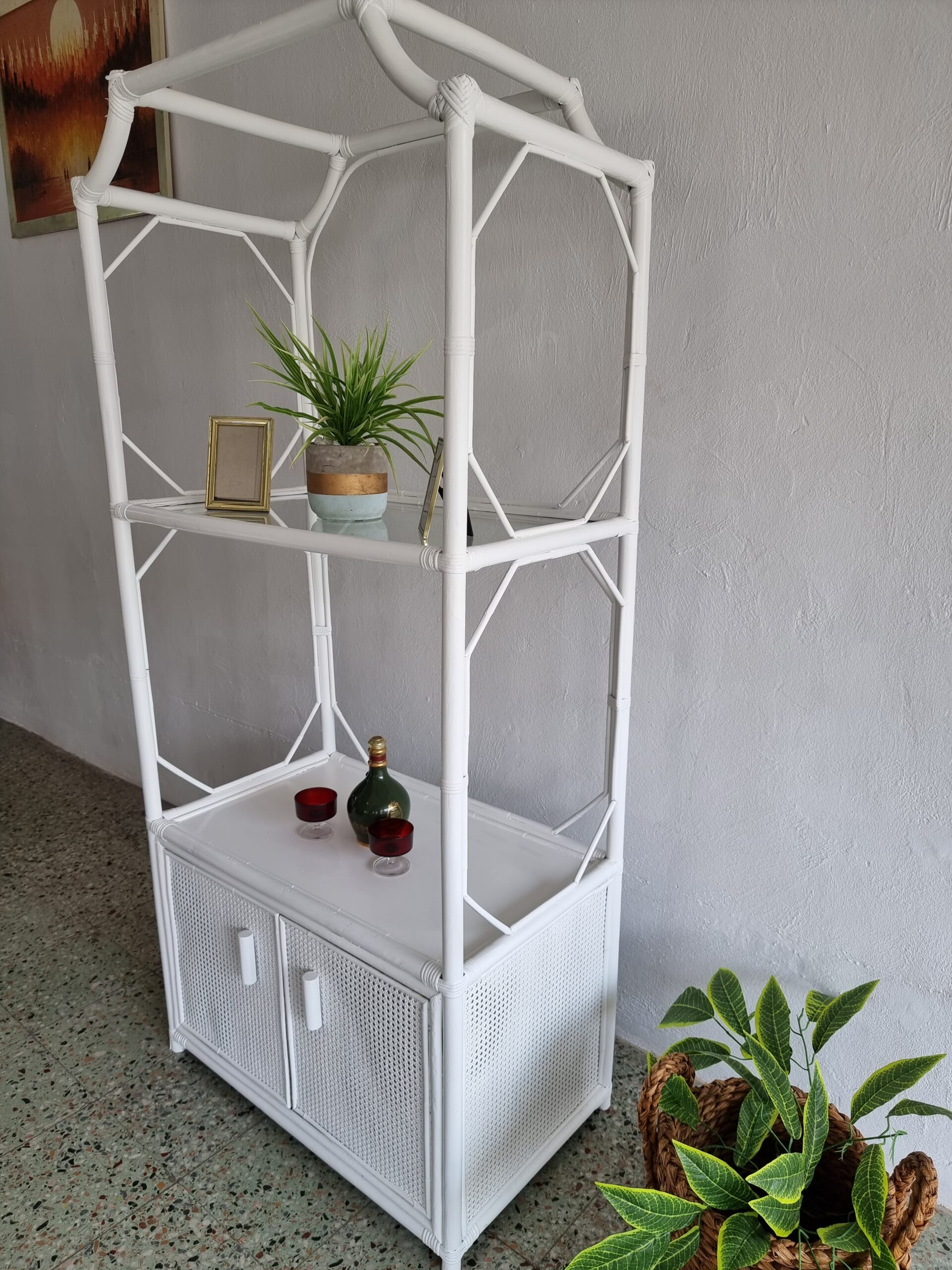 Mid century Etagere Cane display stand that can be used for indoor or outdoor a lovely Patio Display